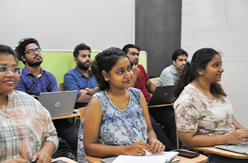 Students in a classroom learning digital marketing